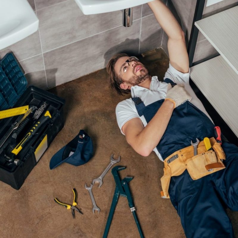 high-angle-view-of-young-male-plumber-fixing-sink-in-bathroom-e1621305605808-p7c9i3evnvf6uv2jbmc4hw2h58ui7fanees551ffcw